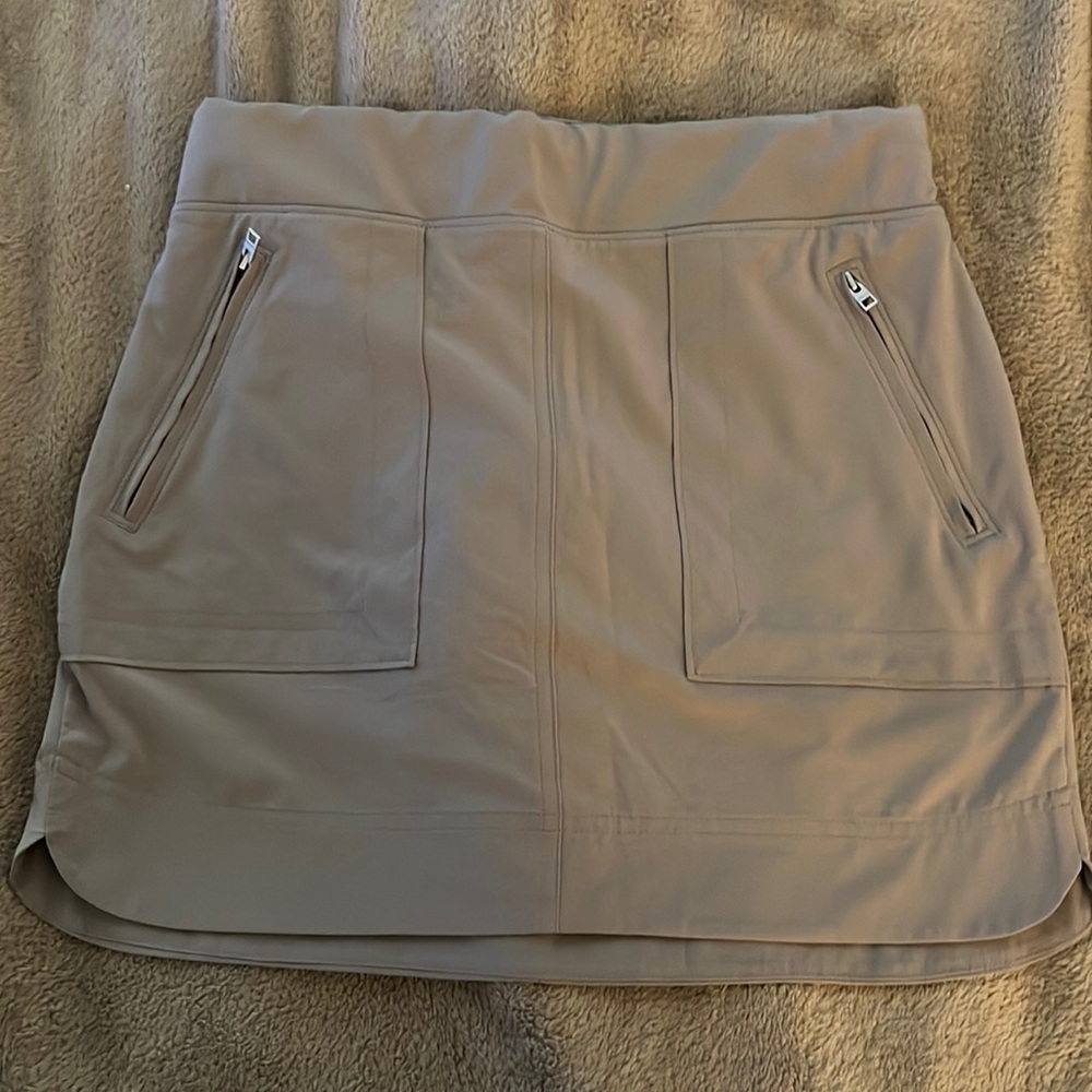 Great for walking or sports, shorts attached underneath. Pockets front & back.